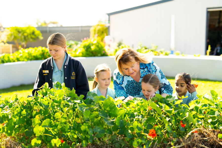 Students and the principal in Sunrise Whyalla's Kitchen Garden.