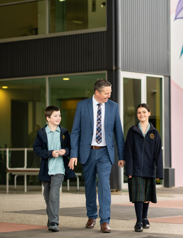 Principal walking with students